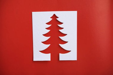 Christmas tree paper cutting design papercraft card. White, red and green colo
