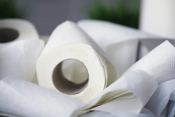 Toilet paper in a roll. Snow-white soft three-layer toilet paper. Lack hygiene products. Primary protection and disinfection.
