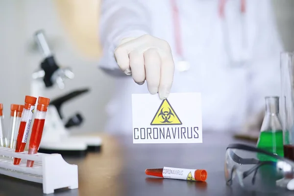 A scientist researcher in the laboratory is testing drugs for treatment of viral pneumonia. Coronovirus blood test of infected patients. World pandemic.