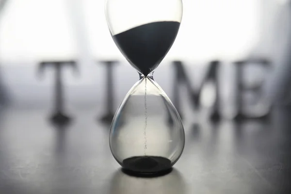 Concept Passage Time Hourglass Dark Background Inscription Time Shadow Surface — Stock Photo, Image