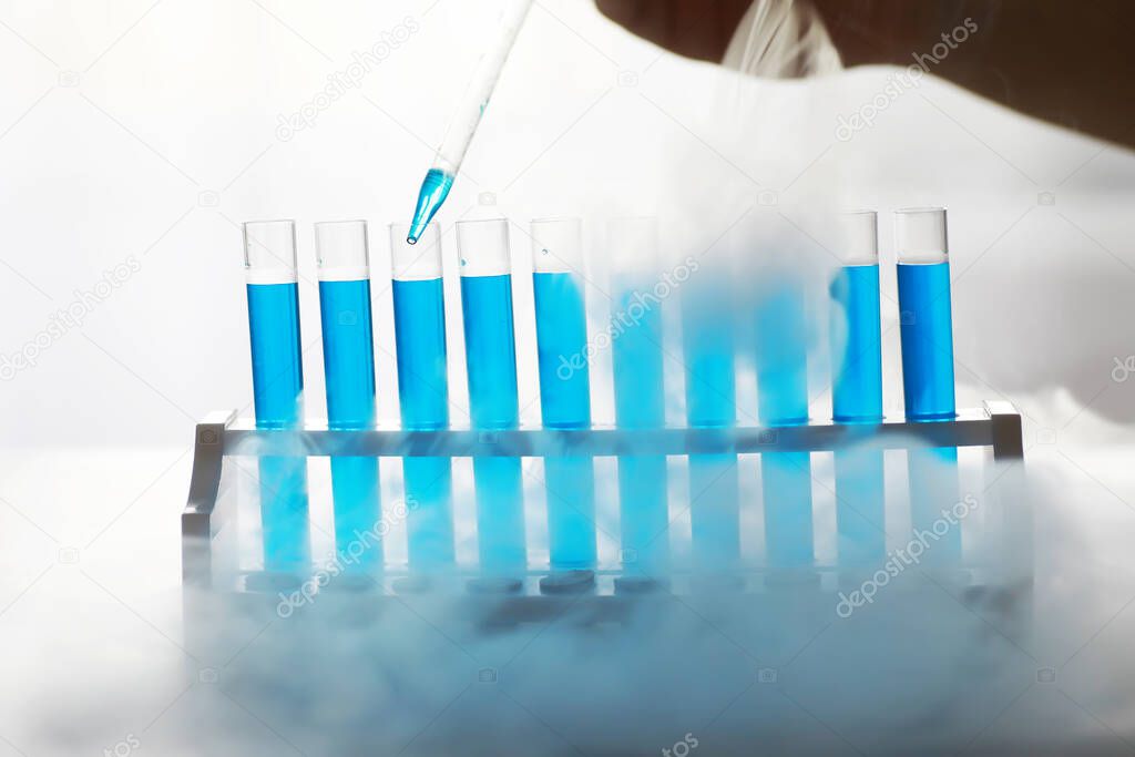 Test tube of glass overflows new liquid solution potassium blue conducts an analysis reaction takes various versions reagents using chemical pharmaceutics cancer manufacturing 