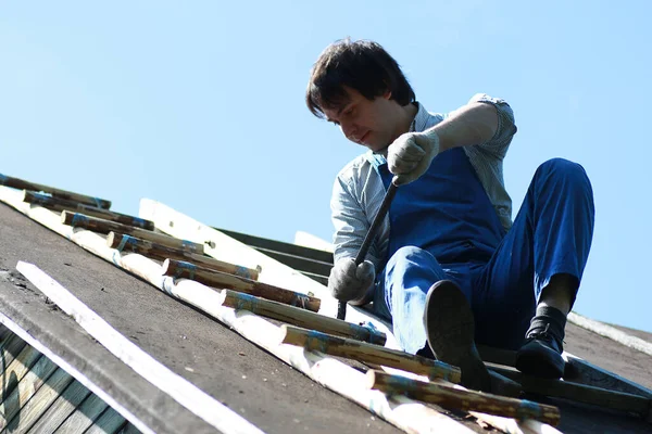 a man in the form of a builder repairs a hous