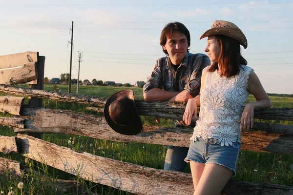 Cute couple on a walk by the countryside summer