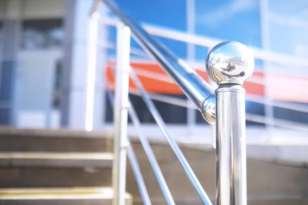 Railing made of glass and stainless steel. Stairs in modern interior. glass railing. Low Angle View Of Stairs Leading Towards modern building.