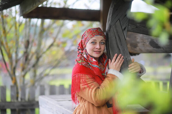Traditional Slavic rituals in the rustic style. Outdoor in summer. Slavic village farm. Peasants in elegant robes.