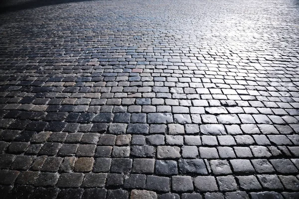 Grey paving stone, pedestrian walkway, pavement close up, the texture, top view.Cement brick squared stone floor background. Concrete paving slabs. Paving slabs