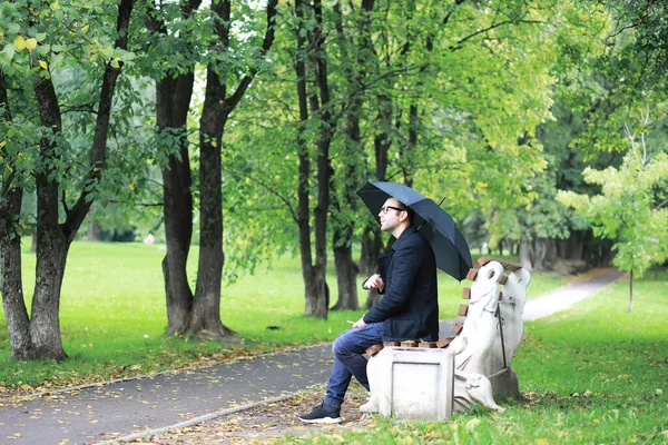 Young Man Glasses Walks Park Umbrella Rain — Stock Photo, Image
