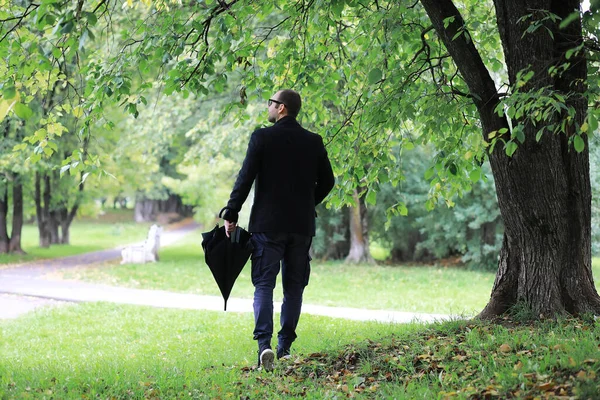 Young Man Glasses Walks Park Umbrella Rain — Stock Photo, Image