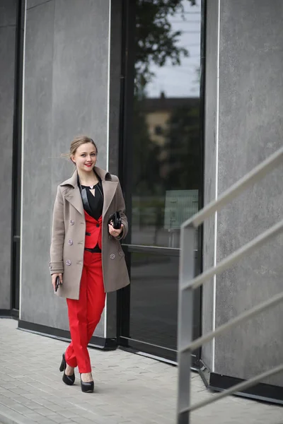 Cute businesswoman goes to a business meeting in a cafe