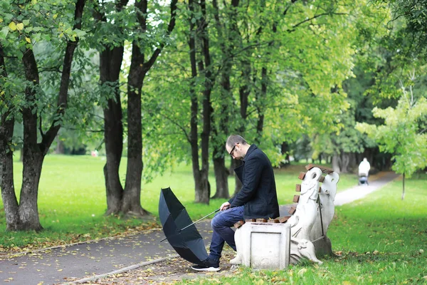 Young Man Glasses Walks Park Umbrella Rain — Stock Photo, Image