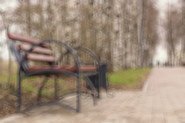 Bench in the park the sun's rays — Stock Photo, Image