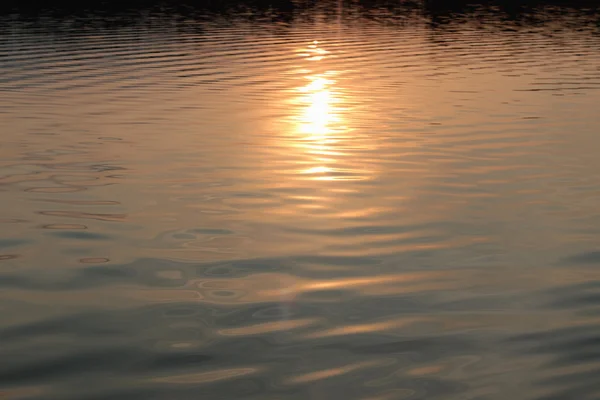 Textura del agua puesta del sol — Foto de Stock