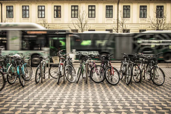 Bicycles Used Commuting Parked City Street Urban Bus Visible Driving — Stock Photo, Image