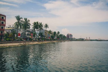 City waterfront of Makassar or Ujung Padang on the island of Sulawesi in eastern Indonesia on an overcast day. clipart