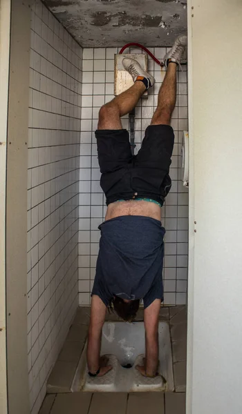 Person Making Handstand Public Squat Toilet White Tiles Other Ceramic — Stock Photo, Image
