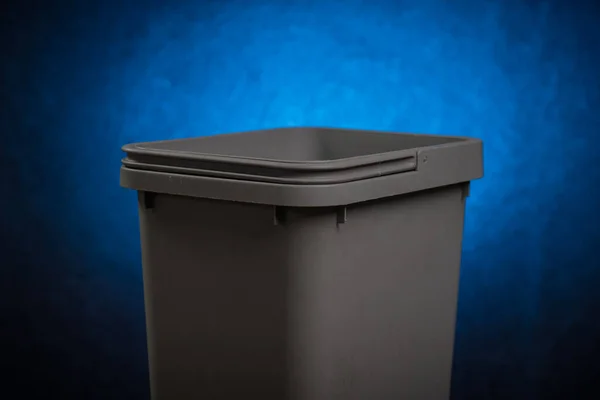 Gray Plastic Trash Can Open Top Visible Handle Dissolving Blue — Stock Photo, Image