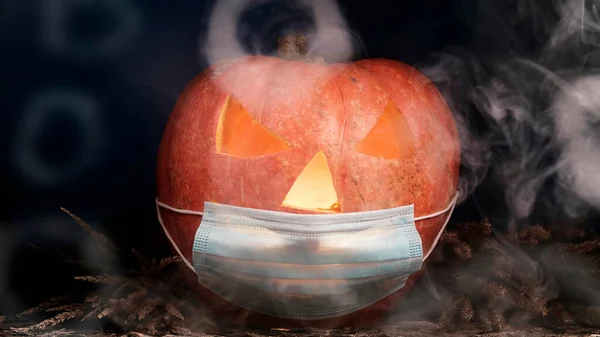 Halloween carved pumpkin glowing with protective medical face mask, coronavirus and quarantine concept, covid-19 halloween costume. eyes change brightness. White smoke.