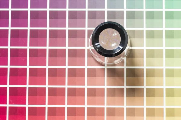 Magnifier on a color chart — Stock Photo, Image