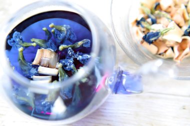 Bright blue color butterfly pea flower herb tea in a glass tea pot