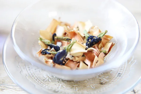 dry herb tea in a glass dish