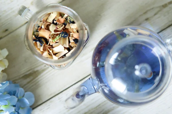 Bright blue color butterfly pea flower herb tea in a glass teapot