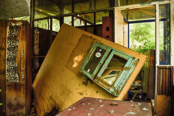 Old abandoned factory rooms and old machines. Rusty metal objects, dusty machines, broken things. Mud, cobweb moisture and mold.