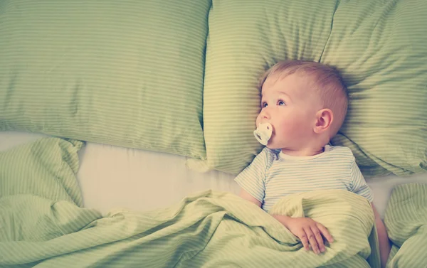 One year old baby in the bed — Stock Photo, Image