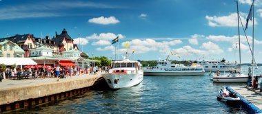 Seaside with boats at Vaxholm island clipart