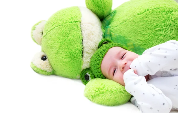 Bebê e sapo brinquedo — Fotografia de Stock