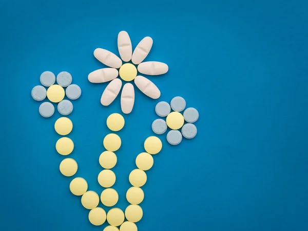 Pills on the blue background — Stock Photo, Image