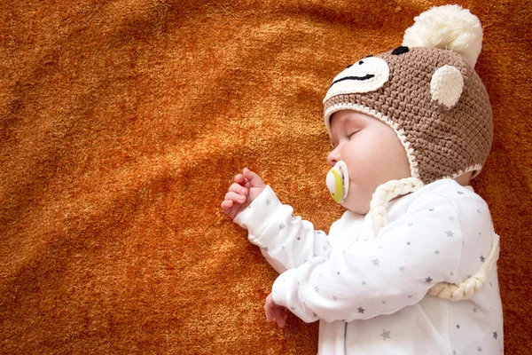 Baby in monkey hat — Stock Photo, Image