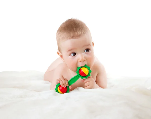 Bebê segurando um brinquedo — Fotografia de Stock