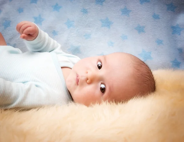 Baby on lamb wool — Stock Photo, Image