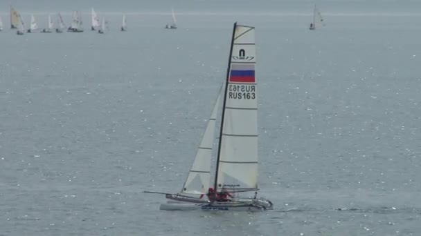 Yacht racing is a competition of athletes in sailing sports in May 2015 in the Black sea near the city of Sochi — стоковое видео