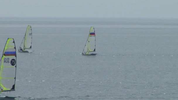 Yacht racing is a competition of athletes in sailing sports in fpril  2015 in the Black sea near the city of Sochi — Stock Video