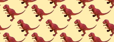 Renkli arka planda oyuncak plastik dinozor. Doku, tasarım, duvar kâğıdı, dekor ve tekstil için kusursuz desen konsepti. Pankart