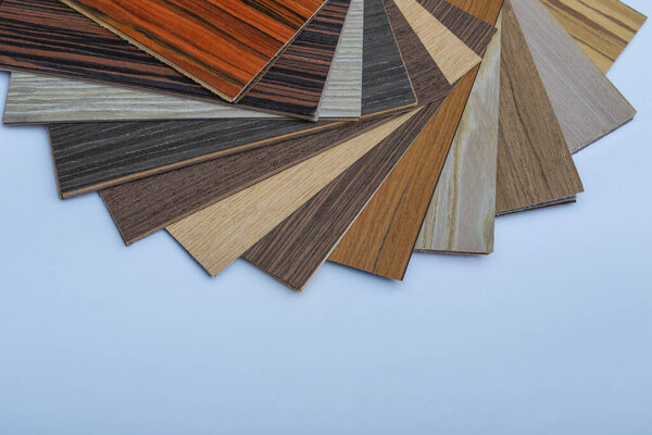 Wood laminate concept. Layout of laminate flooring samples. Samples of color and texture of wood laminate.