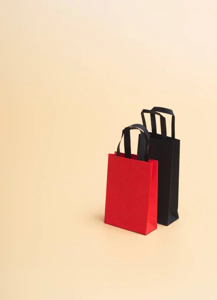 Black friday concept, mockup of paper black and red packages on colored background. Black Friday. With copy space