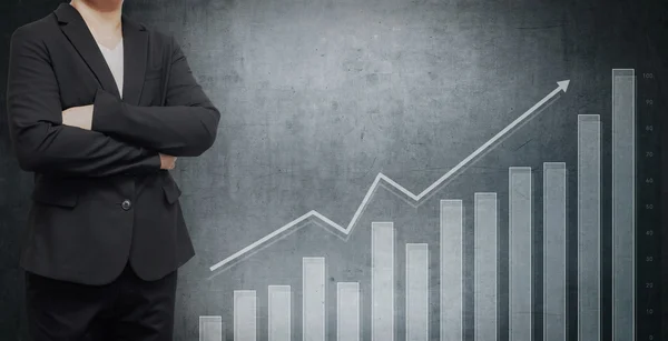 İşadamı ve grafik Finans bir arka plan üzerinde.