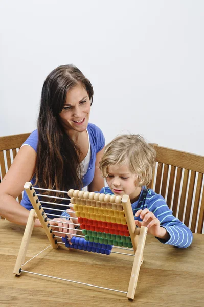 Mother teaches her son to count — Stock Photo, Image