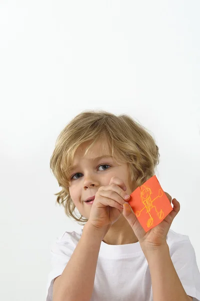 Young boy showing his drawing — Stock Photo, Image