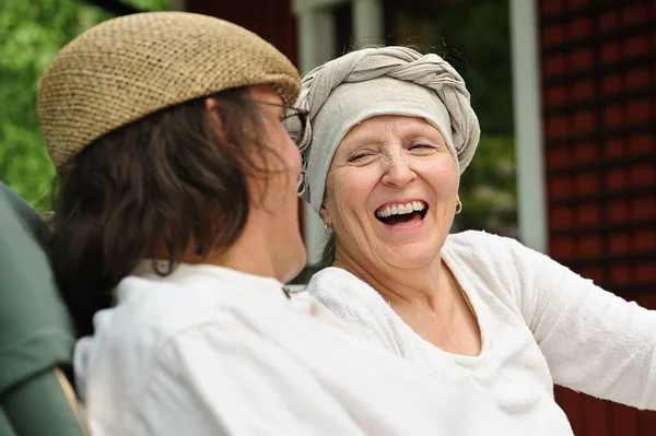 Senior woman laughs at joke — Stock Photo, Image