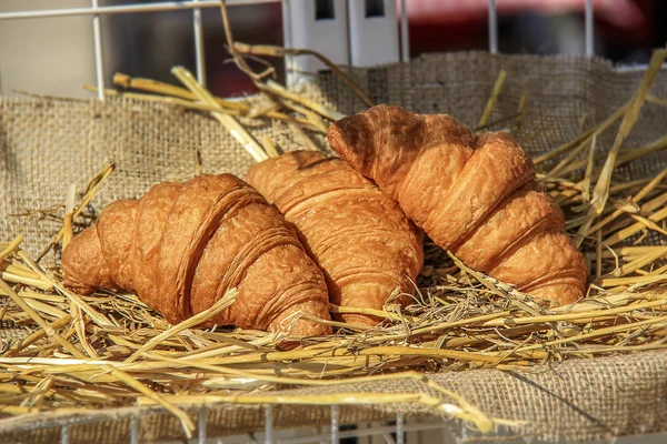 Three golden croissants — Stock Photo, Image