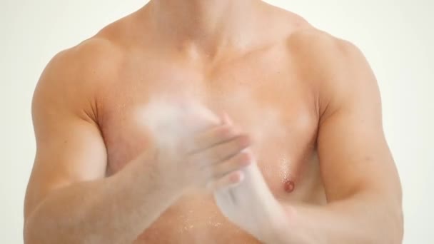 Sweaty Man Claps Hands with Magnesia — Stock Video