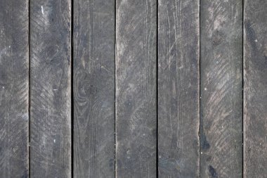 Eski tozlu, gri tahta duvar. Dikey çizgiler. kabaca yüzey dokusu