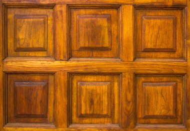 Kare desenli eski sarı kahverengi ahşap duvar. kabaca yüzey dokusu