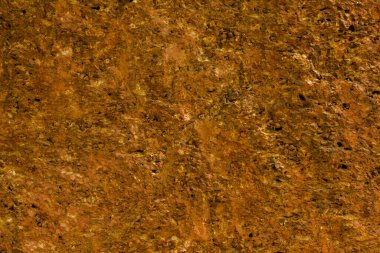 Sarı kehribar pürüzsüz taş duvar. kaba doğal doku yüzeyi