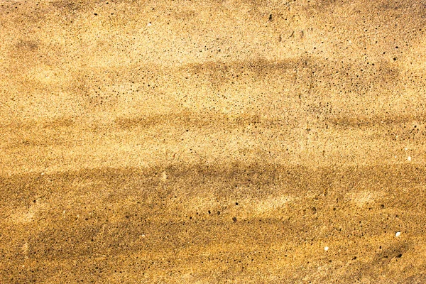 ブラックホールのある黄色の灰色の砂が閉じます 表面の自然な質感 — ストック写真