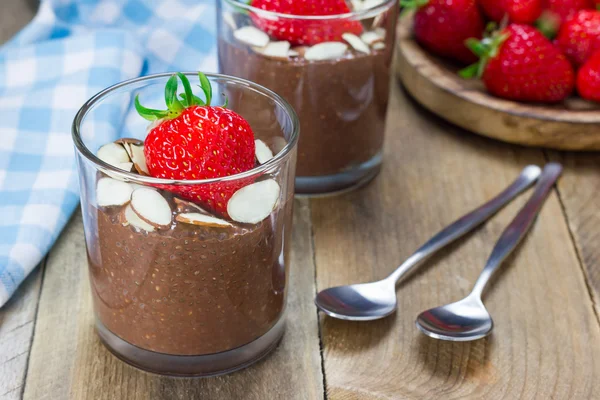 Chocolate chia seed pudding garnished with almond slices and strawberry — Stock Photo, Image