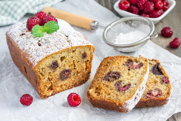 Sliced banana bread with raspberries, cherries and white chocolate, horizontal — Stock Photo, Image